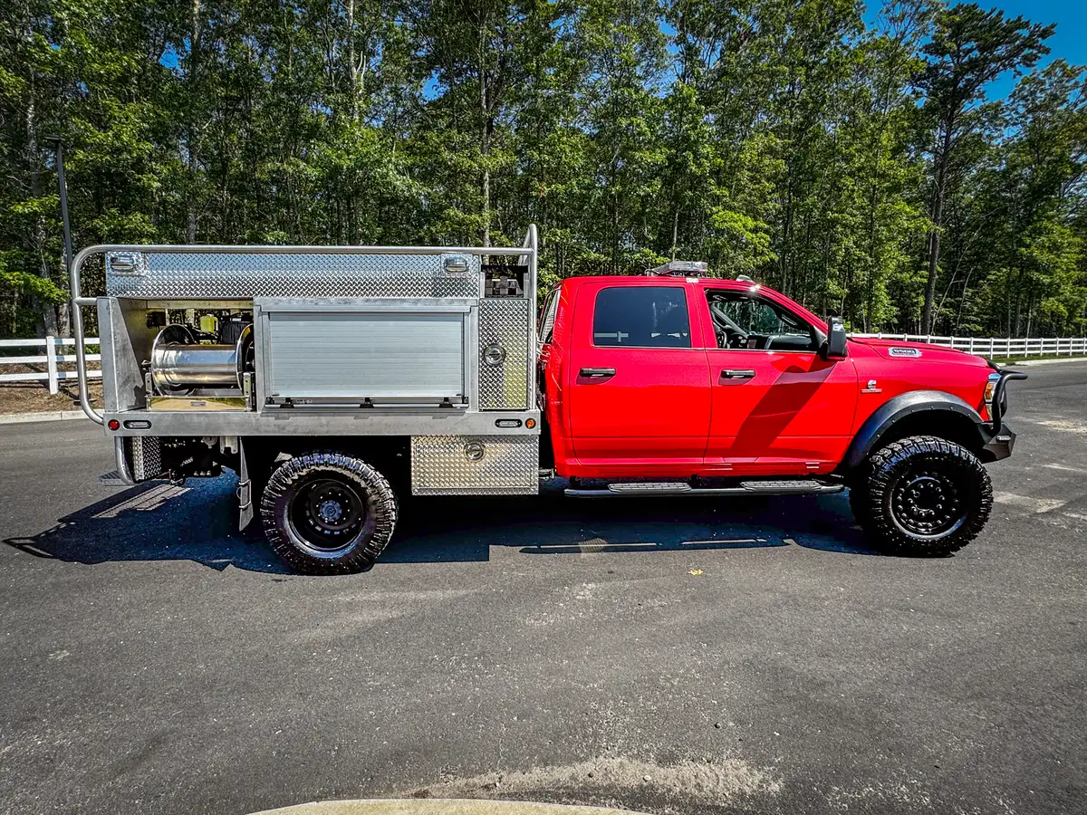 Front-right three-quarter view showing grille guard, bumper, and side body.